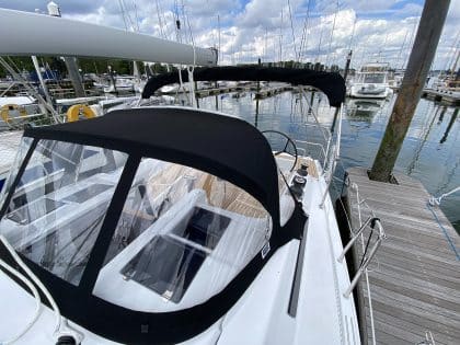 Hanse 348 sprayhood with Sunbrella fabric and optional leathered rear grab bar for enhanced safety and style.