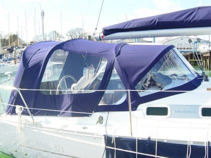 Cockpit enclosure for Beneteau Oceanis 323, fitted to Factory Fit Sprayhood Type 1 with Sunbrella fabric and clear windows.