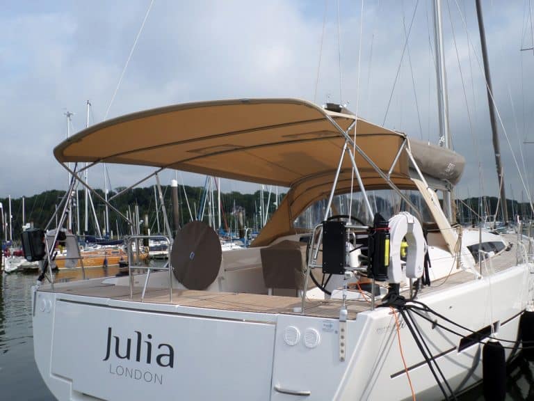 Dufour 560 3 bar Bimini with Sprayhood connection panel, shown with Tecsew Sprayhood