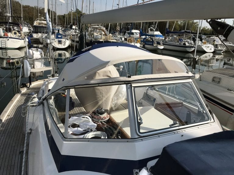 Hallberg 37 sprayhood recover by Tecsew, with a new stainless steel frame and hand-hold cut-outs.