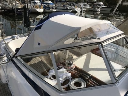 Hallberg 37 sprayhood recover by Tecsew, with a new stainless steel frame and hand-hold cut-outs.