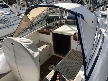 Hallberg 37 sprayhood recover by Tecsew, with a new stainless steel frame and hand-hold cut-outs.