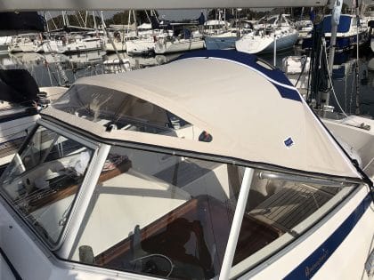 Hallberg 37 sprayhood recover by Tecsew, with a new stainless steel frame and hand-hold cut-outs.