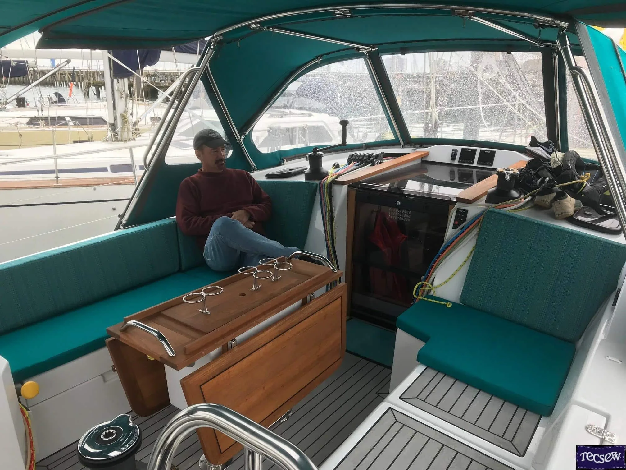 Allures 45.9 with Custom Sprayhood, Bimini, Bimini Enclosure, and Cushions by Tecsew"Alt Text: "An Allures 45.9 yacht featuring a custom sprayhood, bimini, bimini enclosure, and cushions from Tecsew.