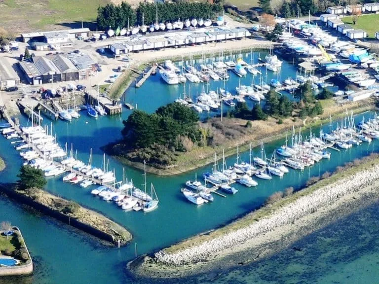 Emsworth Yacht Harbour showcasing tranquil waters, docked boats, and a picturesque marina setting