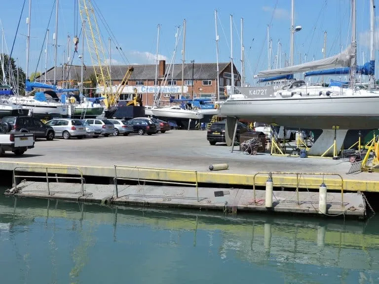 Scenic view of Gosport Boatyard with boats docked and modern facilities, highlighting comprehensive maintenance and repair services.