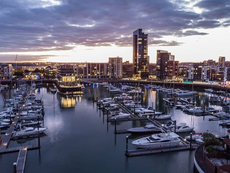 Ocean Village Marina in Southampton with boats docked and waterfront facilities, showcasing Tecsew's custom boat covers and marine canvas products.