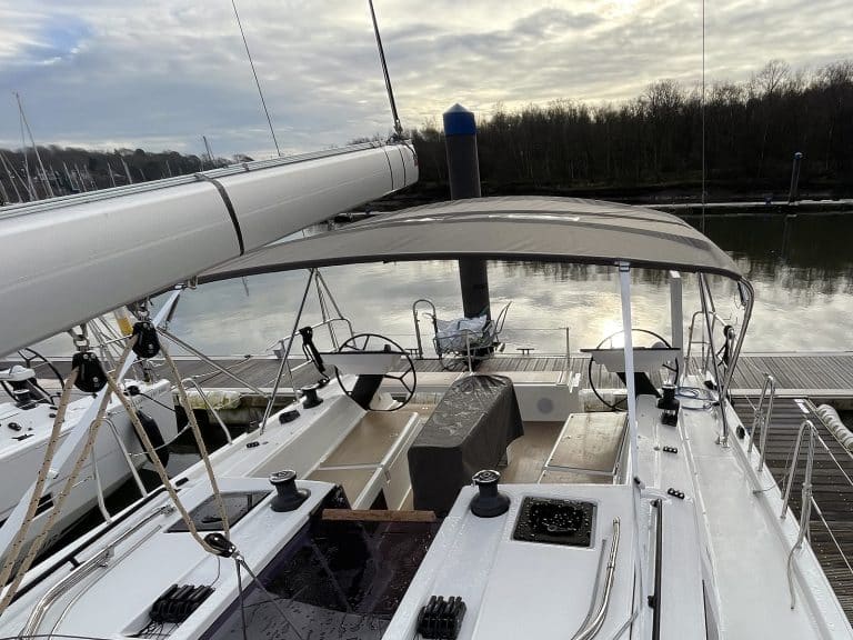 Dufour 41 with Tecsew’s standard bimini installed, featuring a polished stainless steel frame and durable Sunbrella fabric.