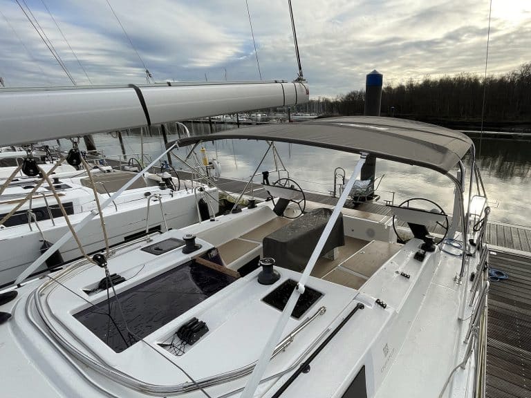 Dufour 41 with Tecsew’s standard bimini installed, featuring a polished stainless steel frame and durable Sunbrella fabric.