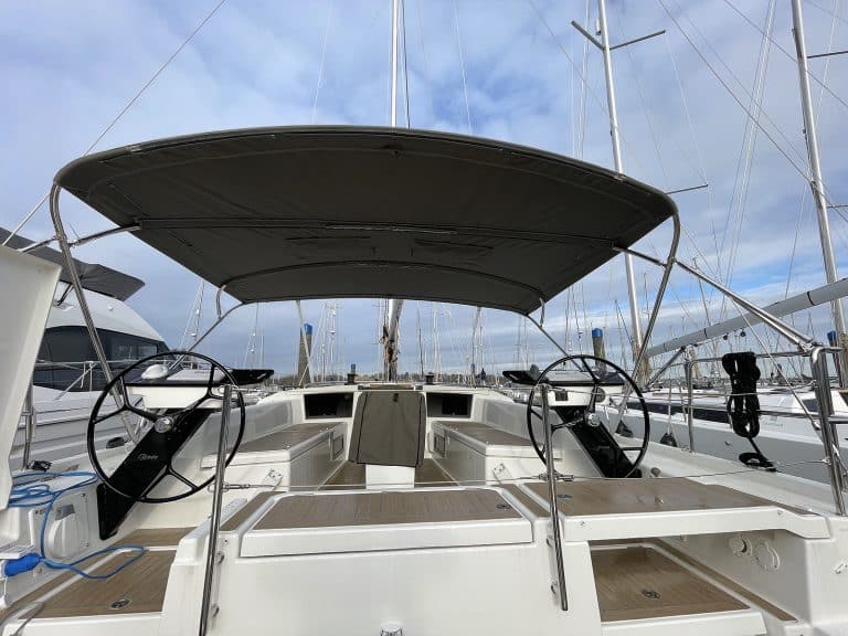 Dufour 41 with Tecsew’s standard bimini installed, featuring a polished stainless steel frame and durable Sunbrella fabric.