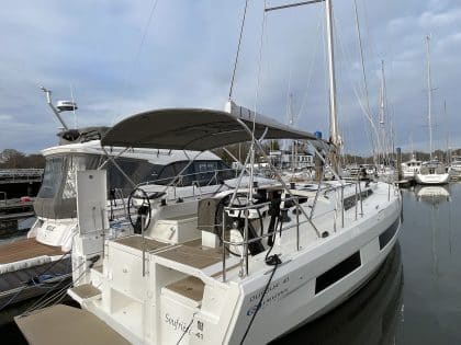 Dufour 41 with Tecsew’s standard bimini installed, featuring a polished stainless steel frame and durable Sunbrella fabric.