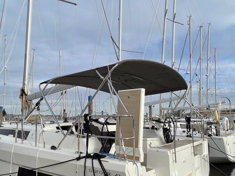 Dufour 41 with Tecsew’s standard bimini installed, featuring a polished stainless steel frame and durable Sunbrella fabric.