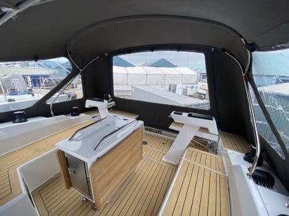 Hanse 410 cockpit enclosure with Sunbrella fabric, Renolit windows, and polished stainless steel frame