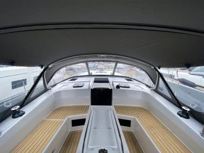 Hanse 410 cockpit enclosure with Sunbrella fabric, Renolit windows, and polished stainless steel frame