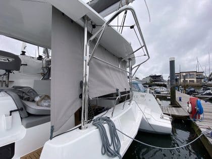 Lagoon 42 with custom cockpit shade panels installed, providing sun protection and versatility.