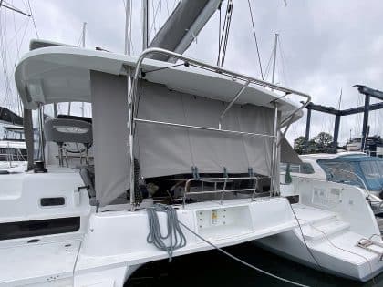 Lagoon 42 with custom cockpit shade panels installed, providing sun protection and versatility.