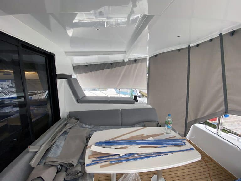 Lagoon 42 with custom cockpit shade panels installed, providing sun protection and versatility.