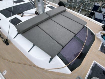 Modular sunbathing mattress set for the Dufour 530 foredeck, arranged and stowed.
