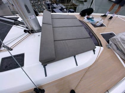 Modular sunbathing mattress set for the Dufour 530 foredeck, arranged and stowed.