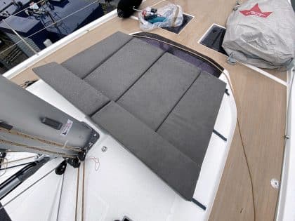 Modular sunbathing mattress set for the Dufour 530 foredeck, arranged and stowed.