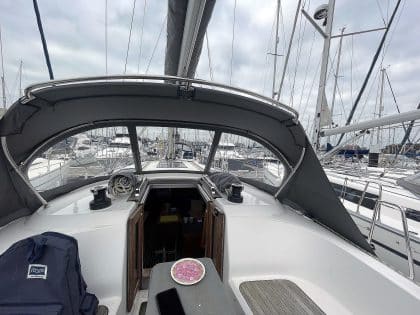 Bavaria Cruiser 37 with a custom higher design sprayhood installed, featuring a sleek, elevated profile
