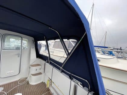 Orkney Pilothouse 24 with a Tecsew cockpit enclosure and stainless steel framework.