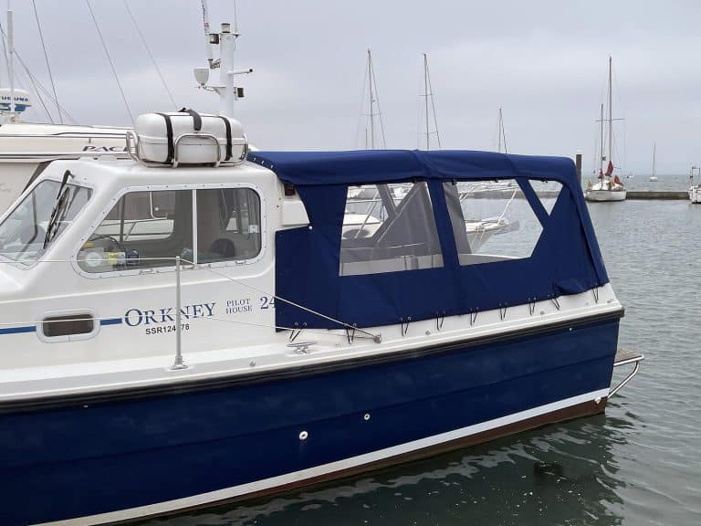 Orkney Pilothouse 24 with a Tecsew cockpit enclosure and stainless steel framework.