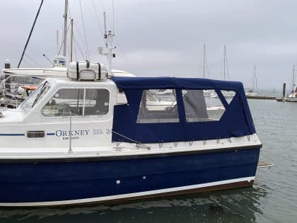 Orkney Pilothouse 24 with a Tecsew cockpit enclosure and stainless steel framework.