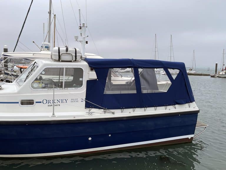 Orkney Pilothouse 24 with a Tecsew cockpit enclosure and stainless steel framework.