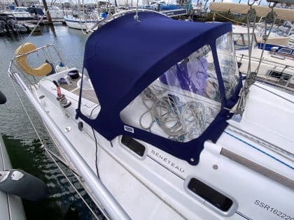 Sprayhood recover for Beneteau Oceanis 323 ROSEBUD in Factory Original Type 3 design with Sunbrella fabric and clear windows.