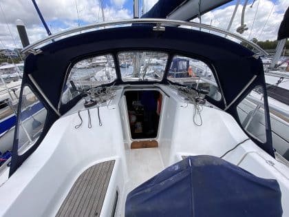 Sprayhood recover for Beneteau Oceanis 323 ROSEBUD in Factory Original Type 3 design with Sunbrella fabric and clear windows.