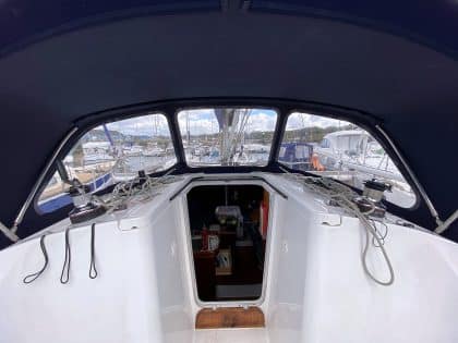 Sprayhood recover for Beneteau Oceanis 323 ROSEBUD in Factory Original Type 3 design with Sunbrella fabric and clear windows.