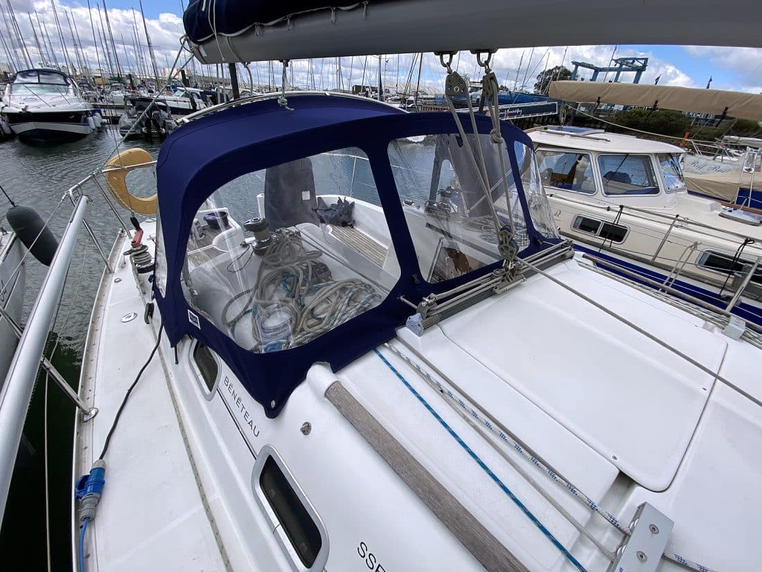 Sprayhood recover for Beneteau Oceanis 323 ROSEBUD in Factory Original Type 3 design with Sunbrella fabric and clear windows.