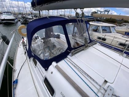 Sprayhood recover for Beneteau Oceanis 323 ROSEBUD in Factory Original Type 3 design with Sunbrella fabric and clear windows.