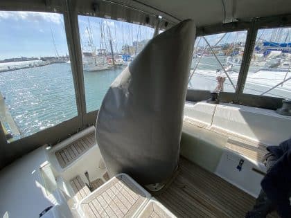 Hanse 400e bimini enclosure with Sunbrella fabric and clear windows, providing a fully enclosed cockpit.