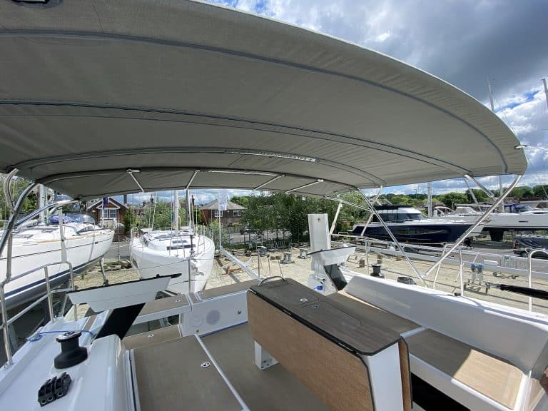 Dufour 41 bimini with aft solar panel extension.
