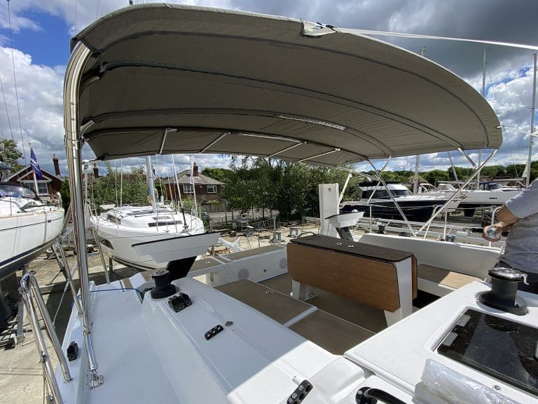 Dufour 41 bimini with aft solar panel extension.
