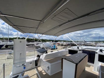 Dufour 41 bimini with aft solar panel extension.