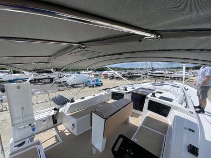 Dufour 41 bimini with aft solar panel extension.