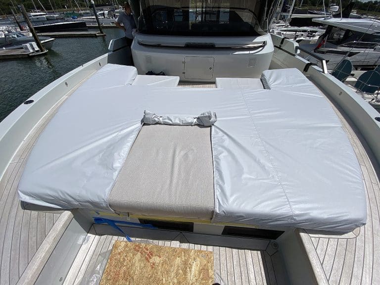 Bluegame X60 forward cushion covers in Stamoid Light fabric, Pearl Grey, with a roll-back access flap for convenience
