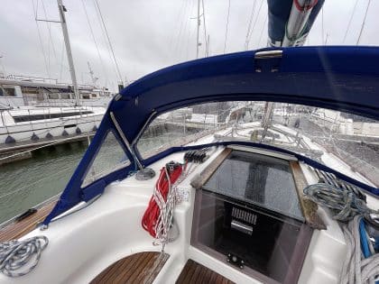 Sprayhood recover for Dufour 38 Classic, featuring Sunbrella fabric and crystal-clear windows for durability and visibility.