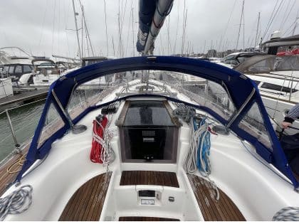 Sprayhood recover for Dufour 38 Classic, featuring Sunbrella fabric and crystal-clear windows for durability and visibility.
