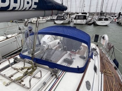 Sprayhood recover for Dufour 38 Classic, featuring Sunbrella fabric and crystal-clear windows for durability and visibility.
