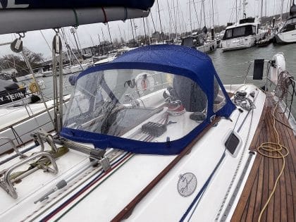 Sprayhood recover for Dufour 38 Classic, featuring Sunbrella fabric and crystal-clear windows for durability and visibility.